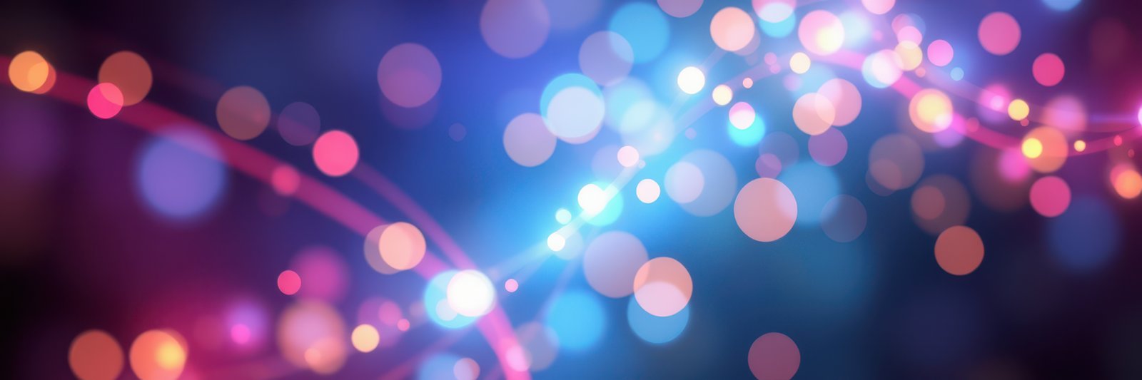 Colorful bokeh lights create a magical atmosphere during a festive evening gathering in a vibrant urban setting